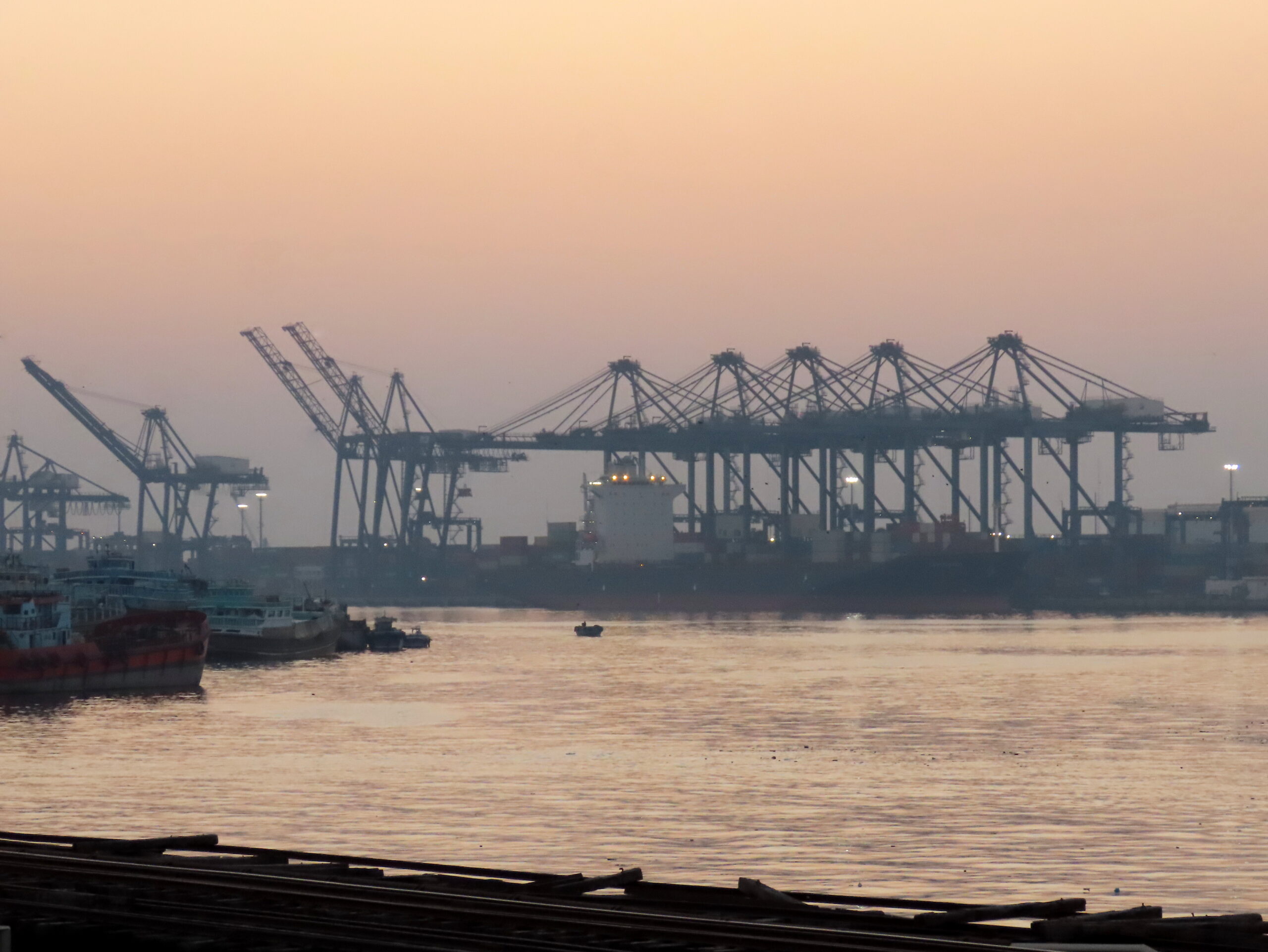 Karachi port operations hit a standstill as transporters' strike enters its 4th day. Imports, exports, and factory supplies are severely impacted, risking economic losses across Pakistan.
